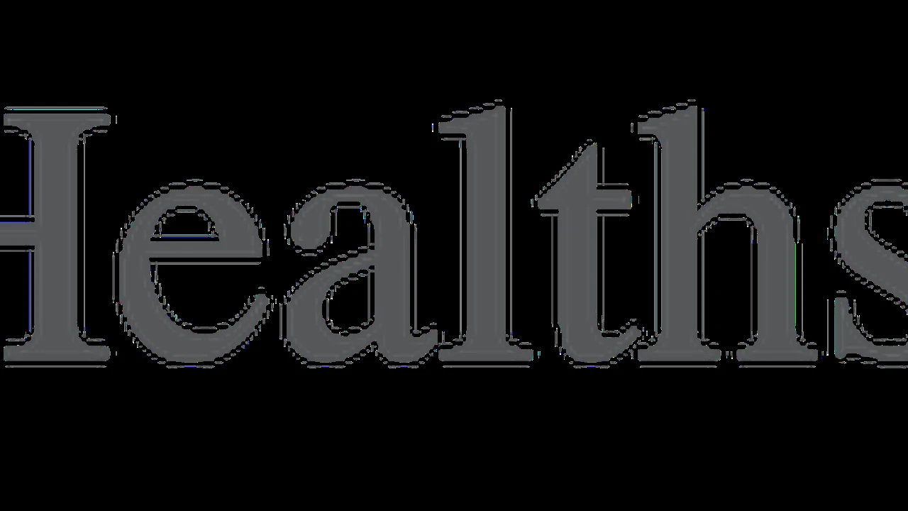 Two mint chocolate milkshakes with whipped cream and green sprinkles.