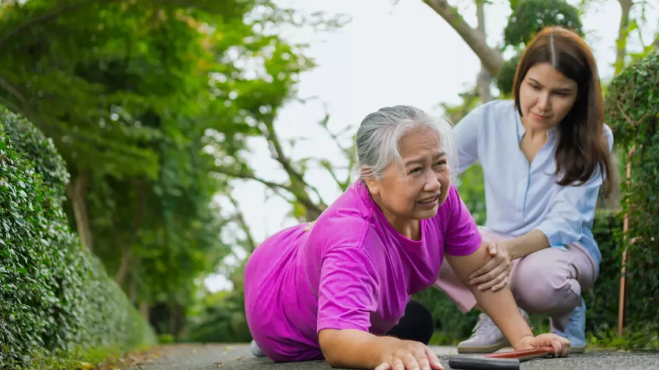 Close up on a plate of mashed potatoes, topped with baked pork chops with cream of mushroom soup, and a side of green beans.